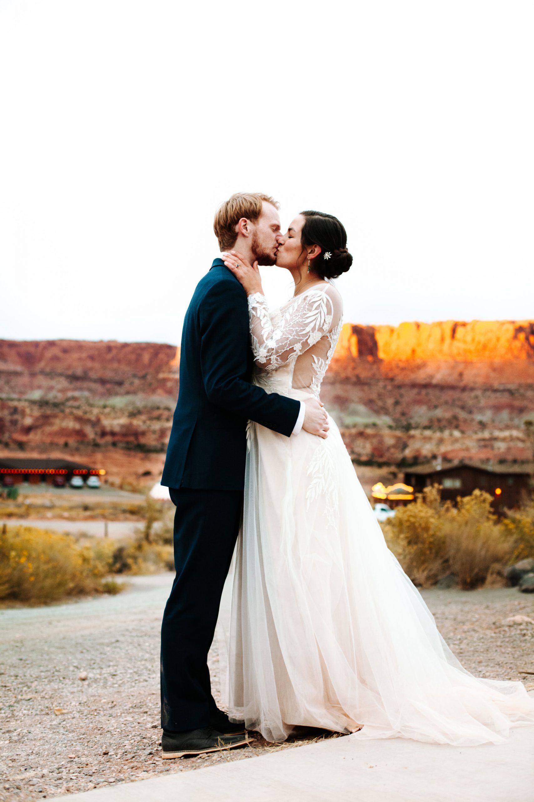 Couple kissing at their fall wedding in Moab, Utah.