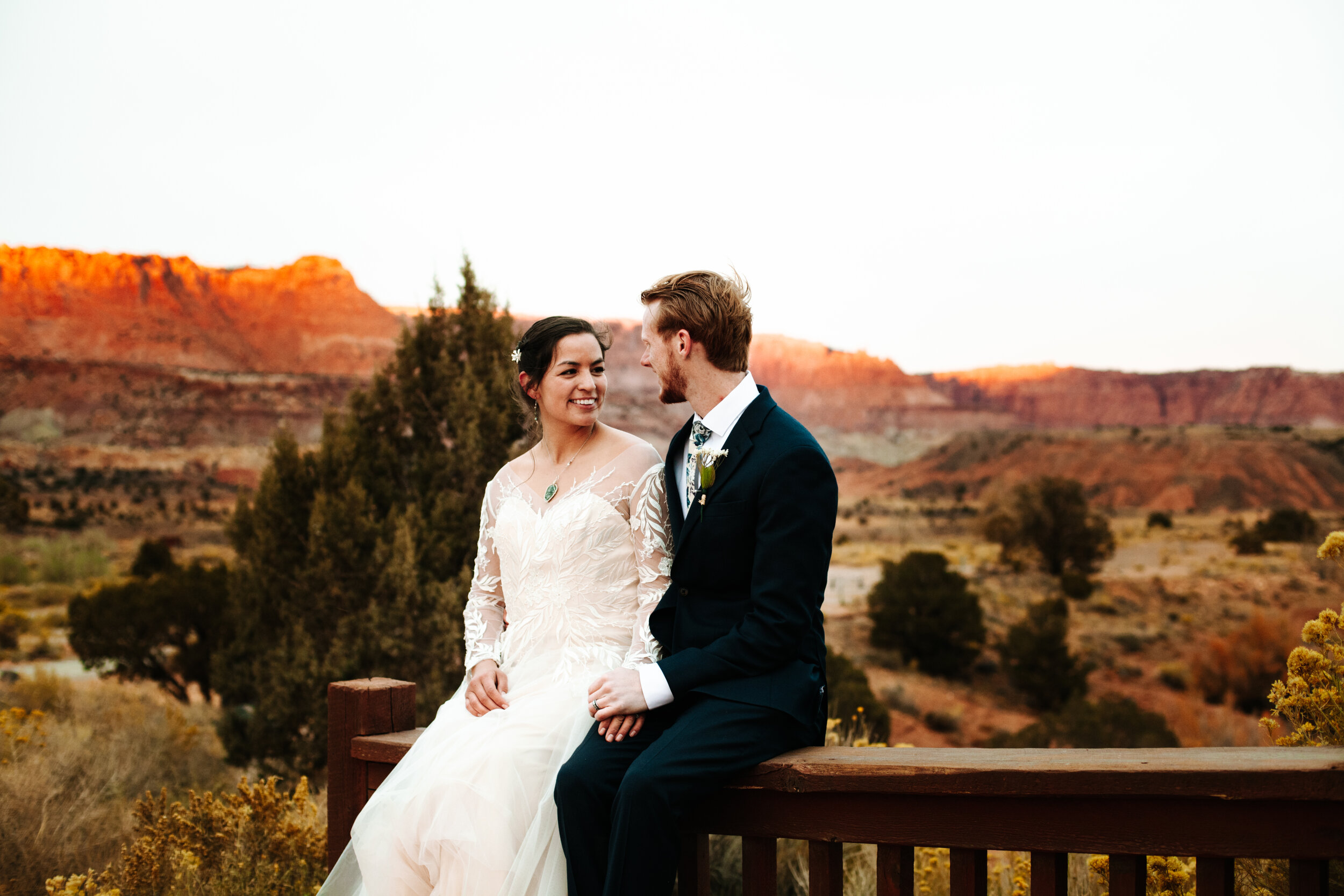 Couple looking at each other at their fall wedding in Moab, Utah.