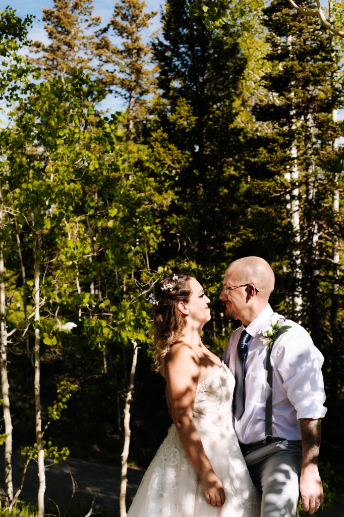 Bride and groom looking at each other at their wedding in the mountains of Park City at Solitude Mountain Resort