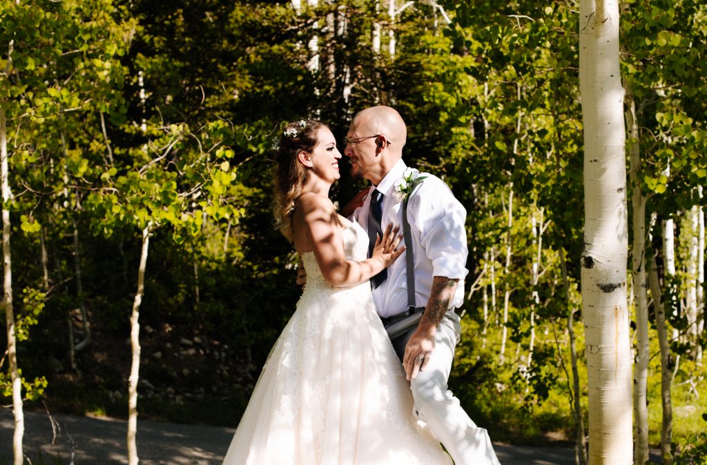 Bride and groom looking at each other at their wedding in the mountains of Park City at Solitude Mountain Resort