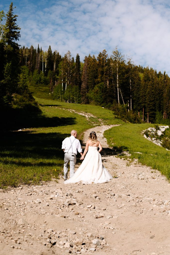 Bride and groom walking together at their wedding in the mountains of Park City at Solitude Mountain Resort