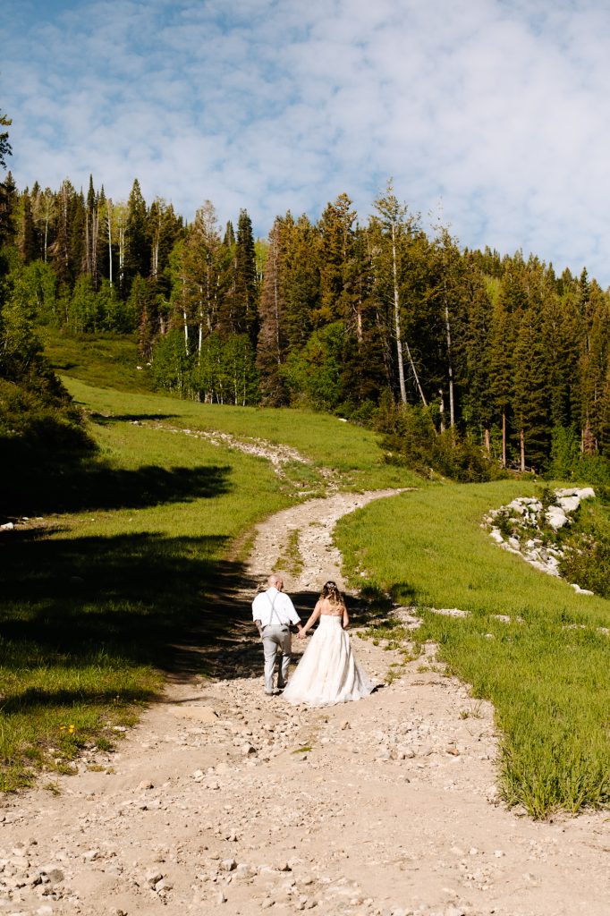 Bride and groom walking together at their wedding in the mountains of Park City at Solitude Mountain Resort